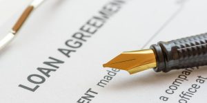 Banks are making it tougher for consumers and companies to borrow money