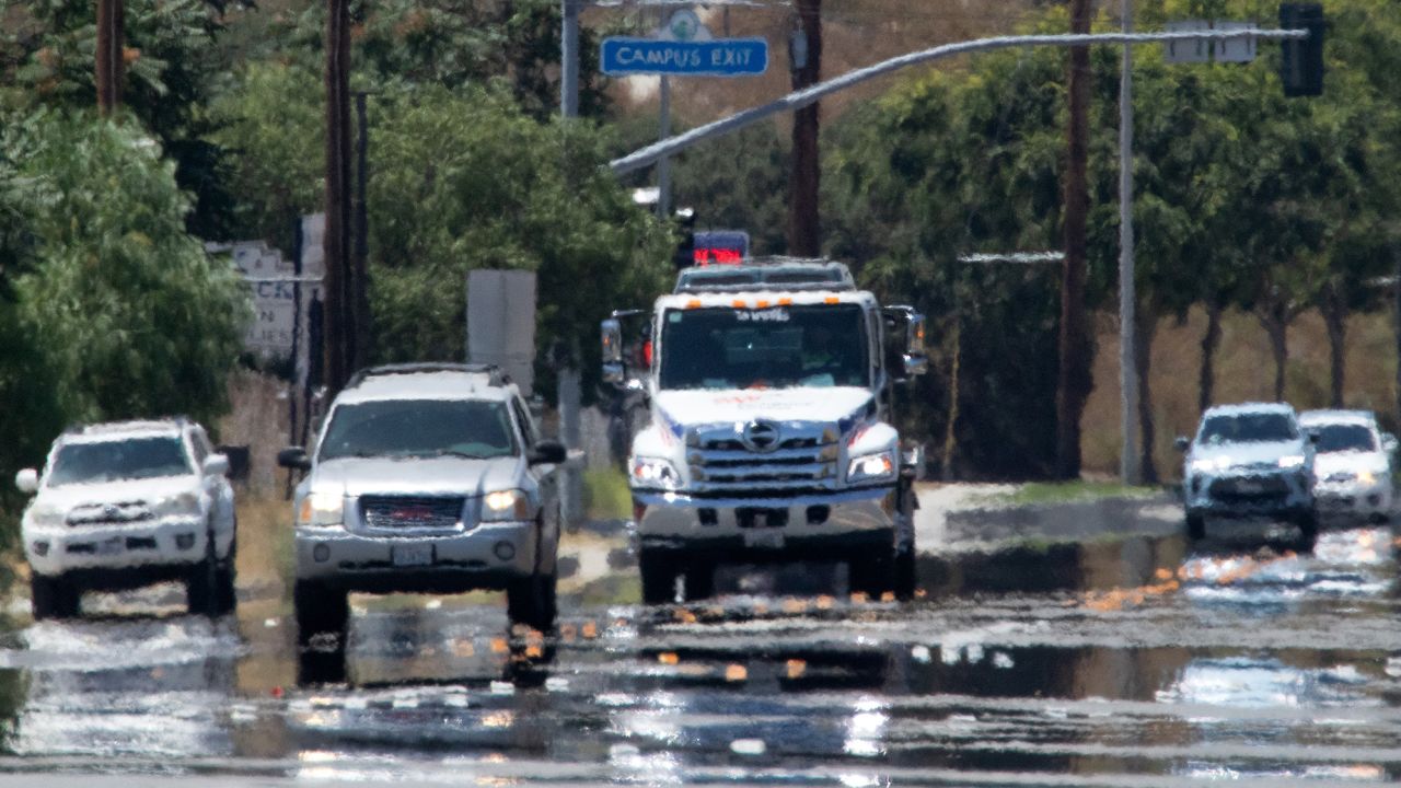 Heat waves and mirage create an impressionistic scene on Sierra Highway during a scorching day on Saturday, July 15, 2023. More triple-digit heat days are in store for the Southland.