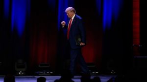 Trump walks onto rally stage as song lyric ‘going to prison’ plays