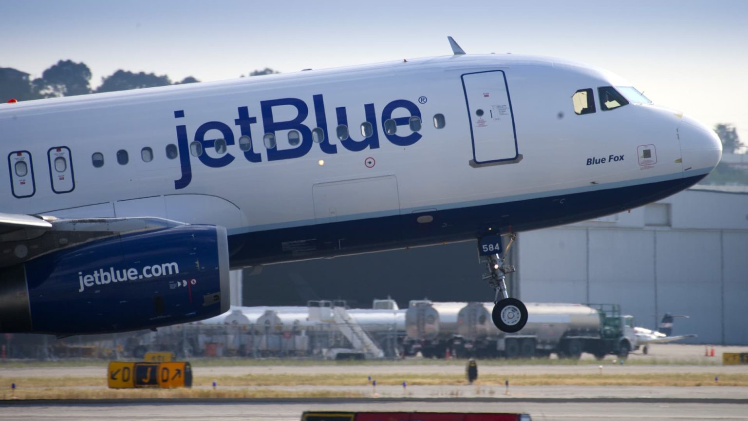 JetBlue cuts forecast on shift to international travel, end of American Airlines partnership