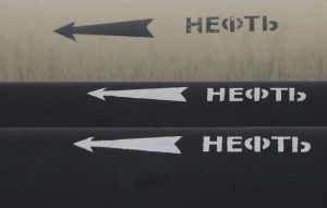 Analysis-Cash-rich Exxon, Chevron use stock for mega deals amid energy market jitters