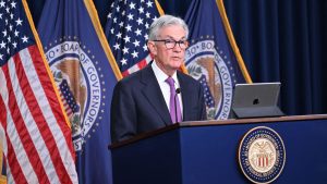 Fed holds rates steady, upgrades assessment of economic growth