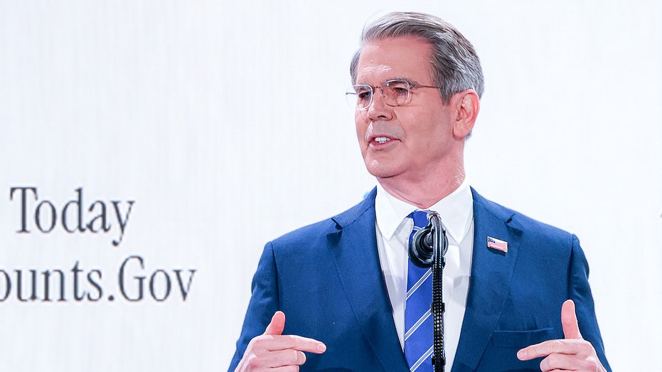 Scott Bessent speaks at a podium during a formal summit event.